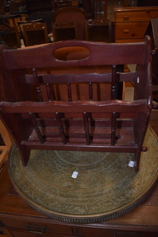 A middle Eastern brass table top and modern stained magazine rack