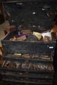 A vintage tool chest containing woodworking chisels and carving tools etc