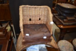 An interesting wicker and leather child seat or saddle, probably 19th Century , with additional