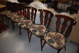A set of six 'Fleur de Lys' style ercol kitchen dining chairs dark stained