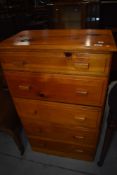 A vintage pine narrow pine chest of five drawers