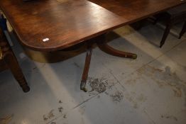 A 19th Century mahogany dining table in the Regency style