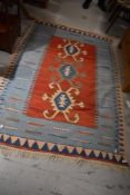 A vintage Kazak or similar rug, approx. 180 x 123