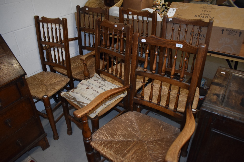 A set of six (four plus two) rush seated spindle back chairs