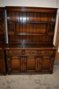 A reproduction oak dresser, probably Titchmarsh and Goodwin