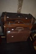 Three vintage leather bound suitcases