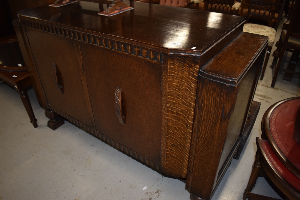 An early 20th Century oak sideboard, with some Art Deco features including internal drawers