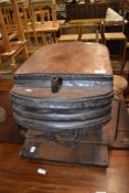 An antique forge or similar bellows