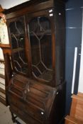 A late 19th or early 20th Century oak bureau bookcase in the Jacobean style