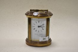 A 1970s Matthew Norman, London, 5 glass carriage time piece of oval form, having visible platform