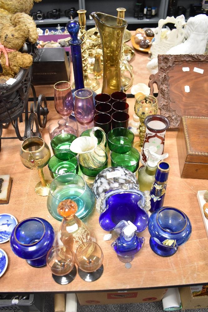 A large selection of mixed vintage coloured glass, to include mid century ruby wine goblets, blue