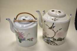 Two oversized Chinese tea pots, one late 19th/early 20th century, the other 20th century, having