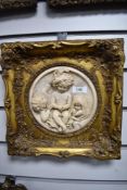 An intricate Victorian style carved marble plaque with depiction of three cherubic children, in