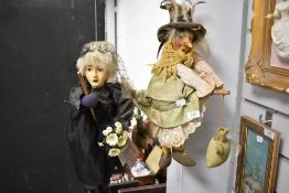 Two collectable witch dolls on broomsticks, including 'kasma' with porcelain head.