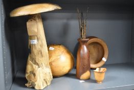A selection of treen, including turned oak bowl and vase, and rustic mushroom etc.