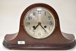An early 20th century hump back mantel clock.