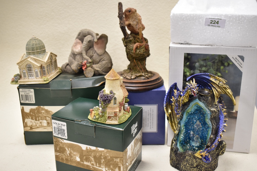 An assortment of figurines and animal studies, to include Lilliput lane 'Gold Top' with box, and '