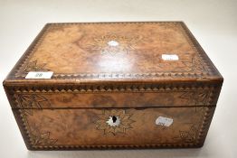 A late 19th century burr walnut box having geometric inlaid decoration, MOP escutcheon and