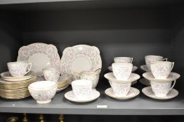 A collection of Mintons 'Petunia' cups and saucers, plates, jug and sugar basin.