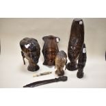 A collection of circa 1930s African wood busts and a letter opened, having tribal styling, also