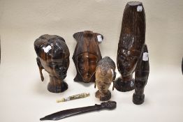 A collection of circa 1930s African wood busts and a letter opened, having tribal styling, also