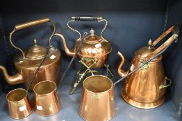 A collection of vintage copper wares, to include kettle, graduated measurers, spirit kettle and