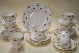 A collection of Adderley bone china 'Floral' cups, saucers, jug and cake plate.
