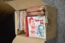 A box full of 45RPM singles, Rock and Roll, easy listening and Popular music etc.