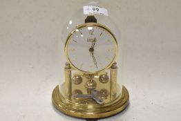 A mid century German made Cresta 400 day Anniversary clock having glass dome.