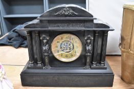 A pre 1900 Victorian slate mantel clock, classical style Architectural design with Greek columns and