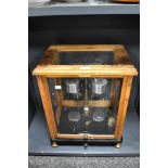 An early to mid 20th century set of scientific scales in glass and oak case, marked Sartorius-