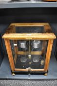 An early to mid 20th century set of scientific scales in glass and oak case, marked Sartorius-