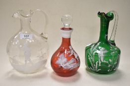 A trio of Mary Gregory style glass wares, to include green glass jug, oval formed clear jug having