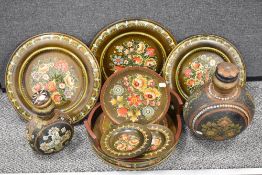 Two 19th/20th century decorative lidded metal flasks, having floral decoration.