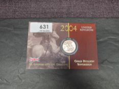 A United Kingdom Royal Mint 2004 Queen Elizabeth II Gold Bullion George & Dragon Sovereign on card