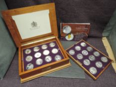 A Royal Mint The Official Golden Jubilee Silver Proof Crown Collection, 24 crown sized Coins GB &