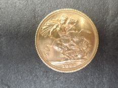 A United Kingdom Royal Mint 1965 Queen Elizabeth II Gold Sovereign