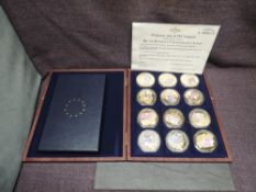 A Windsor Mint British Banknote Commemorative Strike, 12 Cu Gold Plated banknote Medallions in