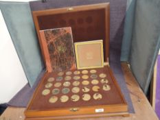 A set of 1970’s silver gilt medallions ‘The Complete Works of Vermeer’, in fitted case with