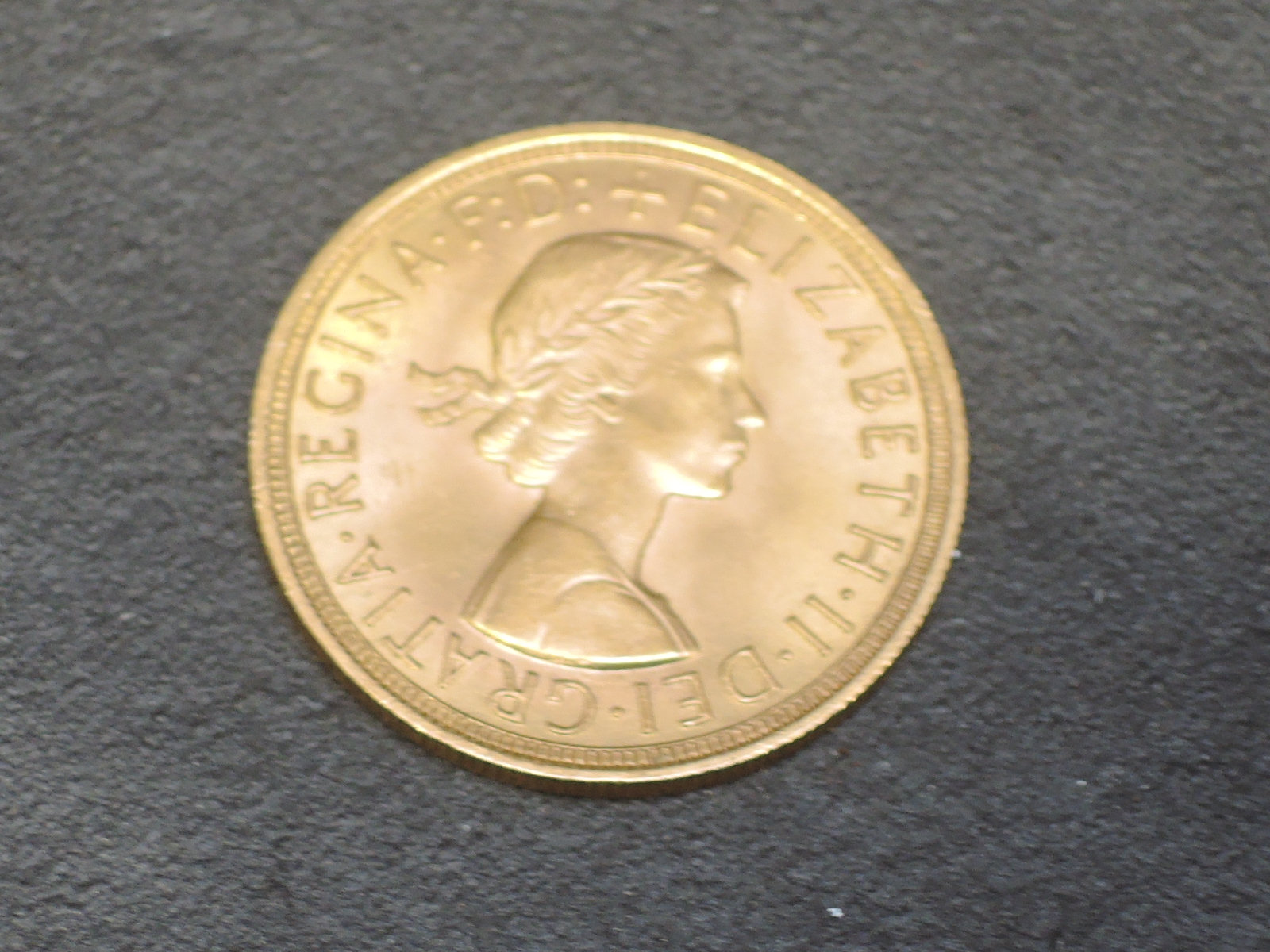 A United Kingdom Royal Mint 1957 Queen Elizabeth II Gold Sovereign - Image 2 of 2