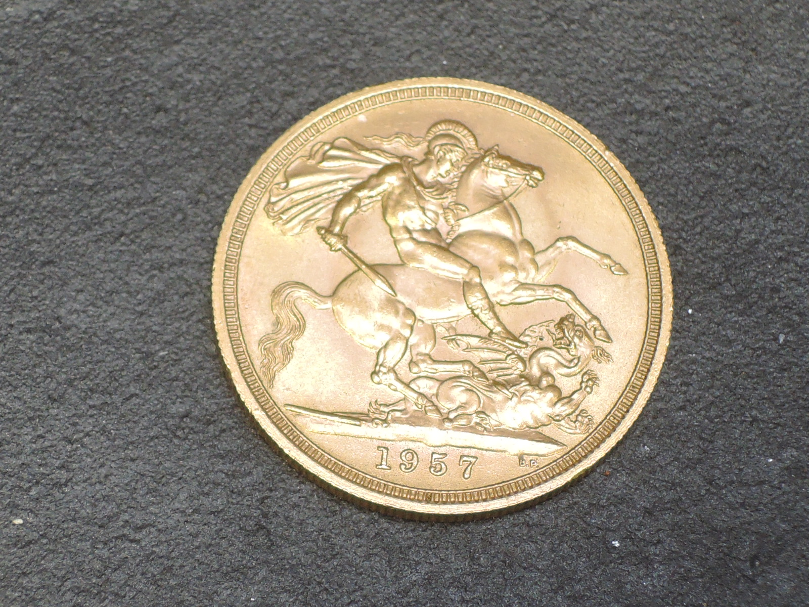 A United Kingdom Royal Mint 1957 Queen Elizabeth II Gold Sovereign