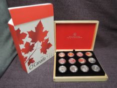 A Canadian 2013 Twelve Coin 10 Dollar Cased Set with certificate with outer box