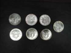 Seven American Silver Dollars, 1990, 1989, 1991, 1992, 1987, 1988 and 1994