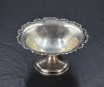 A George V silver pedestal dish, having C-scroll moulded rim and short stem and moulded circular