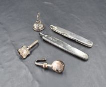 Two hallmarked silver napkin clips of traditional design, sold together with two silver mounted