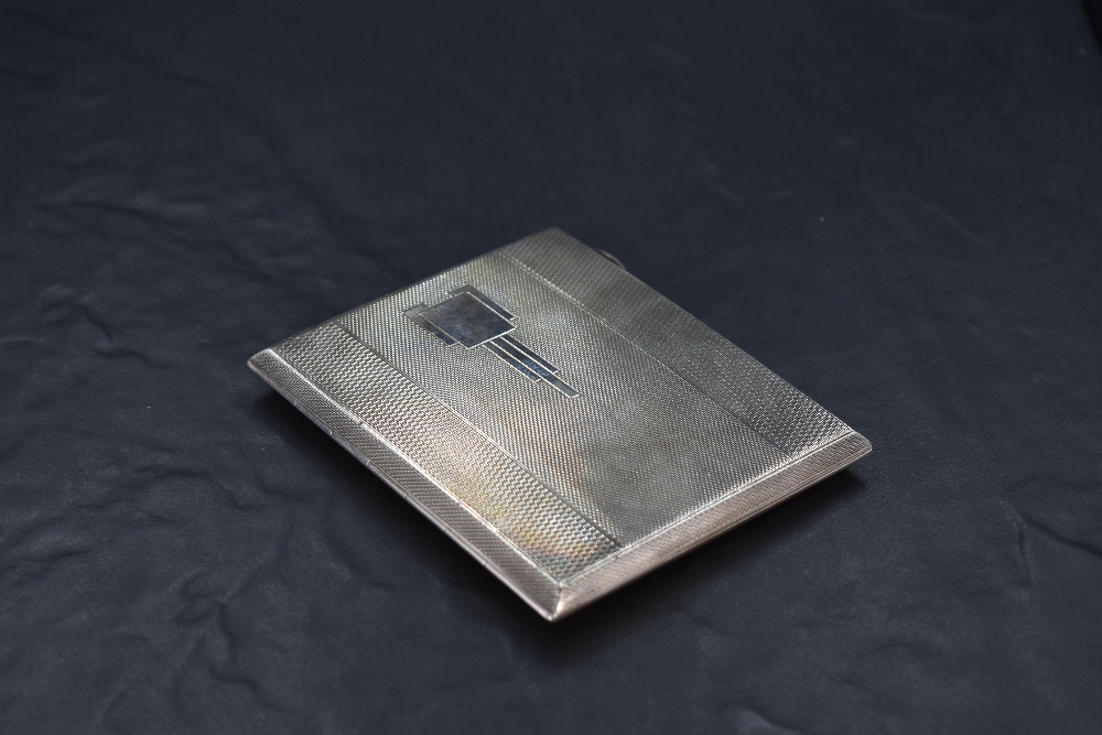 A 1930's Art Deco silver cigarette case, of hinged rectangular form engine-turned throughout and - Image 2 of 2