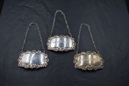 A group of three silver spirit labels, for Sherry, Vermouth and Port, each with English hallmarks,