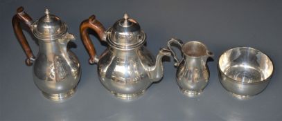 A George V silver four-piece teaset, comprising teapot, hotwater pot, sugar and cream, each of