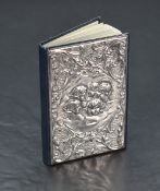 An Elizabeth II silver mounted address book, the silver mount embossed with cherubim within C and
