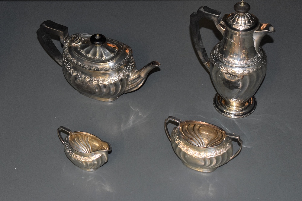 A Victorian silver four piece teaset, comprising teapot, hotwater pot, sugar and cream, of rounded